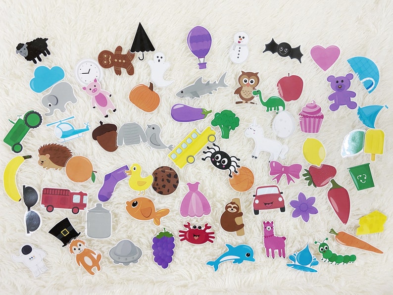 May include: A set of colorful felt stickers featuring various objects, animals, and shapes. The stickers are perfect for crafts, scrapbooking, and other creative projects.