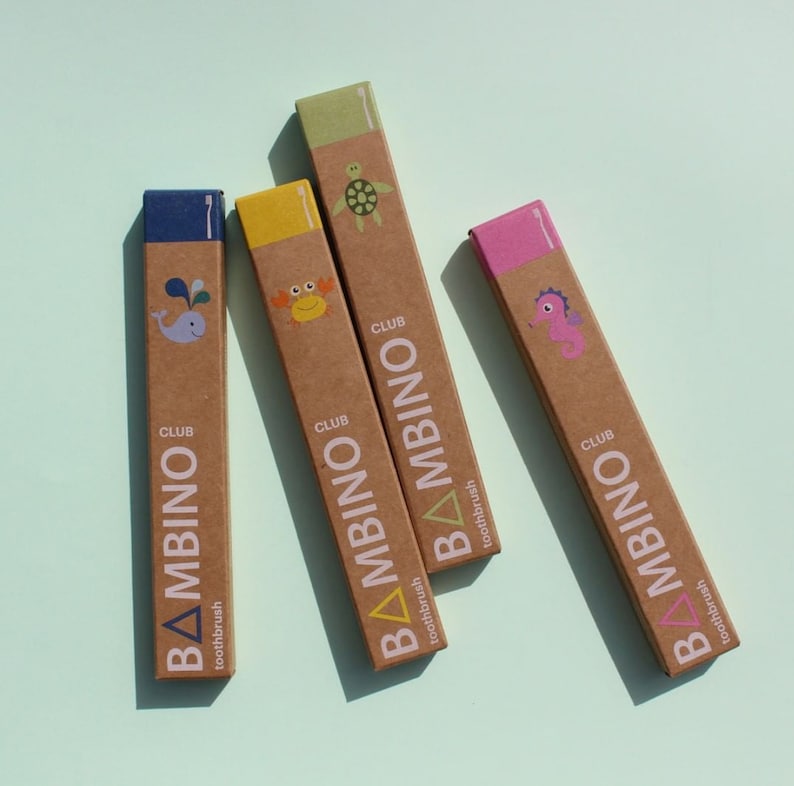 May include: Four brown cardboard boxes with colorful tops, each featuring a different sea creature and the text "CLUB BAMBINOToothbrush".
