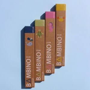 May include: Five cardboard boxes with colorful illustrations of sea creatures and the text "CLUB BAMBINOToothbrush" on each box.