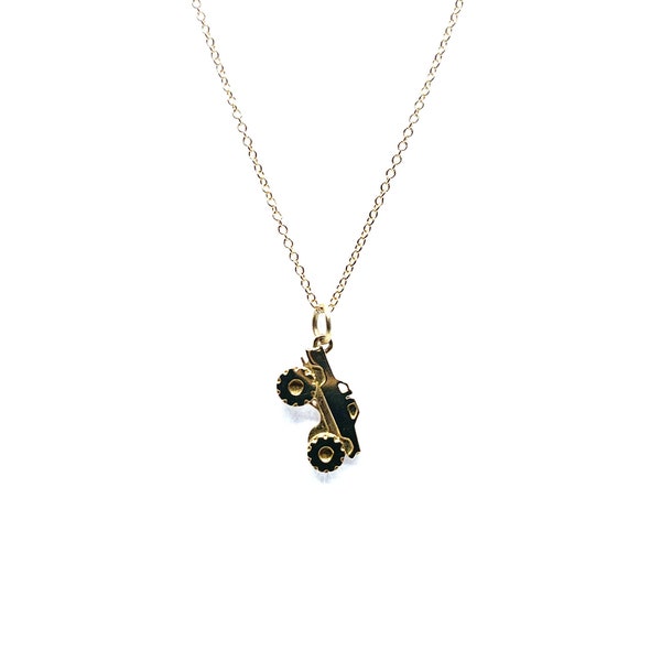 14k monster truck necklace.