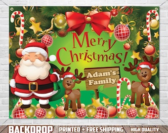 May include: A green Christmas backdrop with a red bow, Santa Claus, two reindeer, candy canes, and ornaments. The text "Merry Christmas! Adam's Family" is on the backdrop.