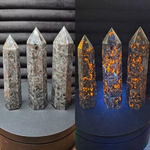 May include: Three hexagonal stone towers shown in two lighting conditions. Under natural light, the stones appear grey and speckled. Under UV light, the same stones exhibit bright orange fluorescent patches across their surfaces.