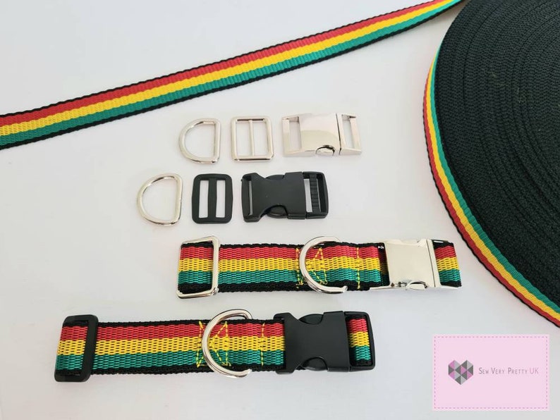 May include: A set of red, yellow, and green striped webbing for making a dog collar or leash. The set includes two metal D-rings, two metal slide buckles, one black plastic buckle, and one black plastic slide buckle. The webbing is 25mm wide.