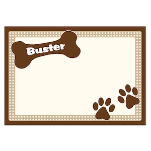May include: A brown dog bone with the name "Buster" on it, surrounded by a brown frame with white polka dots. Two brown paw prints are in the bottom right corner.