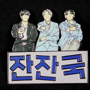 BTS “Jan Jan Kook” Hard Enamel Pin featuring Jin, J-Hope, and Jungkook from a Bangtan Bomb