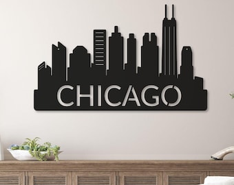 May include: Black metal Chicago skyline wall art. The city's name is cut out in white. The artwork is made of natural birch wood and handmade in the USA. The image also includes a quality guarantee.
