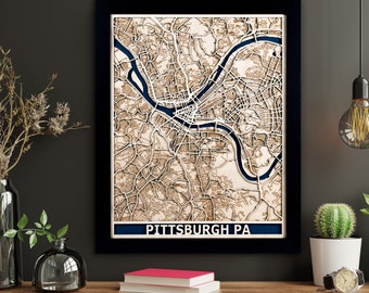 May include: A wooden wall art piece featuring a detailed map of Pittsburgh, Pennsylvania. The map is laser cut and painted in shades of brown and blue. The city name is displayed at the bottom of the map.