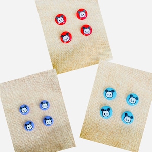 May include: Four red, four blue, and four purple buttons with a cartoon Mickey Mouse face on each.