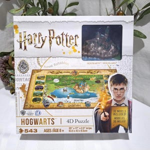 May include: A Harry Potter Hogwarts 4D puzzle box. The box features the Harry Potter logo, a map of Hogwarts, and an image of Harry Potter. The puzzle measures 25" x 17" x 2.5" and includes 3D models.