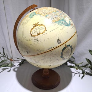 May include: A set of three ceramic mugs with a speckled, matte finish. The mugs are in shades of cream, light gray, and dark gray. Each mug has a simple, minimalist design, perfect for coffee or tea.