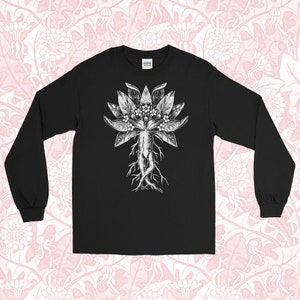 May include: Black long-sleeve t-shirt with a white graphic of a stylized plant with roots and leaves.