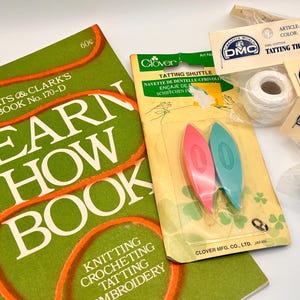 May include: A green Coats & Clark's Learn How Book, a Clover tatting shuttle package containing one pink and one teal shuttle, and three individual packages of white DMC tatting thread, all featuring clear branding and instructional text.