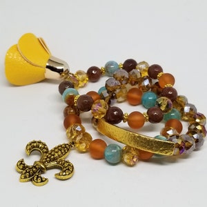 Mustard, teal, brown, burnt orange Earth-tone stack
