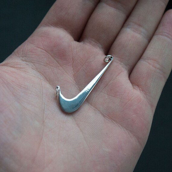 Swoosh (two holes)