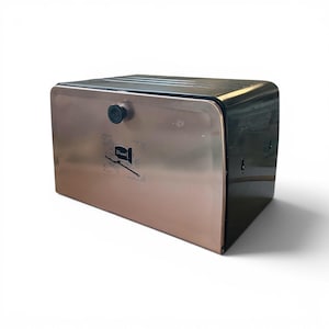 May include: A rectangular metal bread box featuring a metallic copper-colored front door with a black knob. The door displays a black graphic of a brick wall, a loaf of bread, and the word Bread. The top and sides of the container are black.