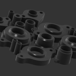 Może przedstawiać: Grupa czarnych gumowych tulejek w różnych rozmiarach i kształtach. Tulejki są zaprojektowane do ochrony przewodów i kabli przed ścieraniem i zużyciem.