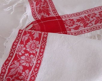 Shiny gorgeous linen damask table cloth with red woven borders