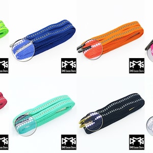 Può includere: Otto paia di lacci con accenti riflettenti in vari colori, tra cui verde neon, blu, arancione, rosa, rosso, verde menta, nero e bianco.