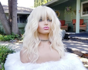 Bleach 613 blonde wig, wavy with bangs, synthetic long, heat resistant, light blonde, platinum blonde, honey blonde hue, layered wig, Barbie