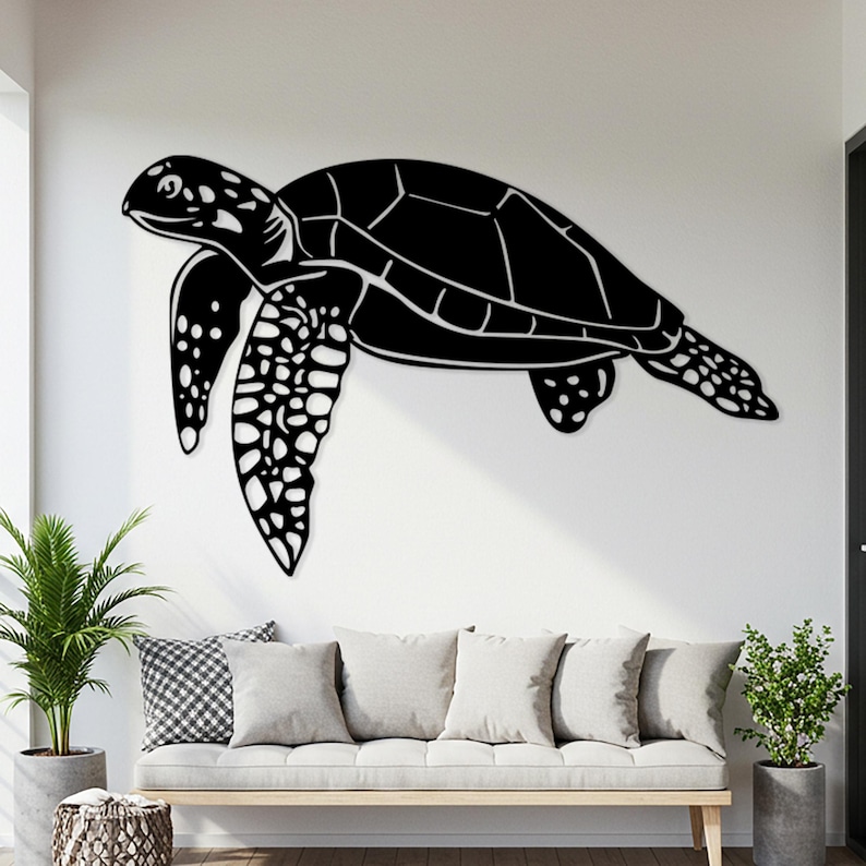 May include: A large, black metal sea turtle wall art piece. The turtle is depicted in a side profile, with detailed patterns on its shell and flippers. The artwork is mounted on a white wall above a neutral-toned sofa.