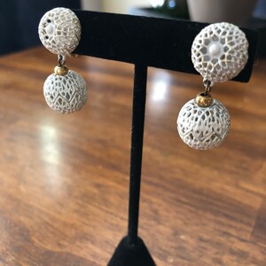 Beautiful vintage Monet Patd white and gold clip on earrings