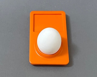 Excepcional Apple iPod Eggcup, diseñado por Michael Neubauer. Para coleccionistas de Apple.
