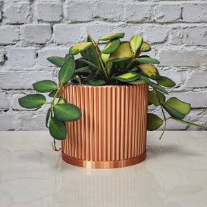 Sleek Mid-Century Modern Ribbed Planter Pot with Optional Drip Tray In Shiny Copper Color