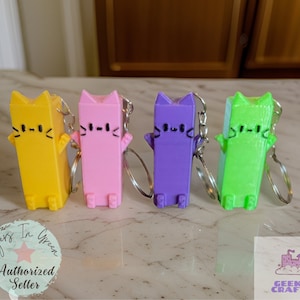 Pixel Purrfect: 8-Bit Cat Charm - A Must-Have Keychain for Cat Lovers and Gamers.