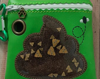 May include: A bright green pouch with a zipper closure and a decorative white trim. The pouch features a brown glittery design with cartoon poop emojis. A green carabiner clip and a paw print charm are attached.