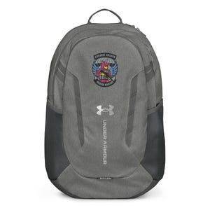 May include: Gray Under Armour backpack with a black mesh side pocket. The backpack features a patch with a cartoon unicorn holding a gun, the words "Airborne Unicorn" and "Modern Warfare". The Under Armour logo is visible.