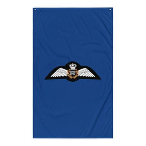 May include: A blue fabric flag with a white and black Royal Air Force (RAF) emblem. The emblem features a crown, a wreath of leaves, and the letters "RAF".