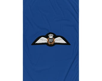 May include: A blue fabric flag with a white and black Royal Air Force (RAF) emblem. The emblem features a crown, a wreath of leaves, and the letters "RAF".