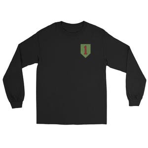 May include: A black long-sleeve t-shirt featuring a shield-shaped patch on the upper left chest. The patch is olive green with a dark red number one centered inside. The shirt has a crew neckline and long sleeves with ribbed cuffs at the wrists.