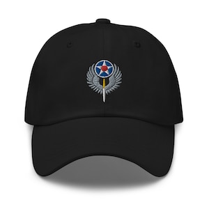 May include: Black baseball cap with an embroidered Air Force Space Command logo featuring a star, wings, and a sword.