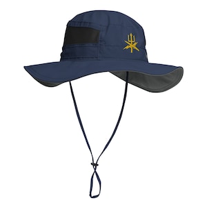 May include: A navy blue sun hat with a wide brim and a black mesh panel. The hat has a gold embroidered logo of a trident and lightning bolts.