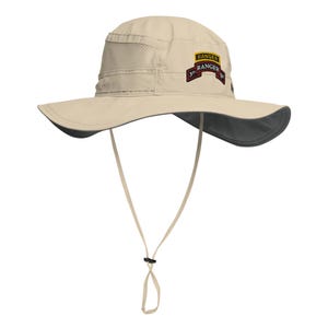 May include: A beige sun hat with a wide brim and a dark gray underside. The hat features a mesh panel on the side and a small patch with text. It has a chin strap with an adjustable toggle.