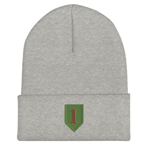 May include: Gray beanie with a green and red embroidered patch featuring the number "1".