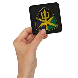 May include: A black embroidered patch with a gold trident and lightning bolts on a green, blue, and yellow shield.