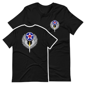 May include: Black t-shirt with a white and blue Air Force emblem on the front and back. The emblem features a star, wings, and a sword.