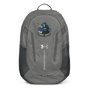 May include: Gray Under Armour backpack with the text "UNDER ARMOUR" and a "GHOST RIDER" patch. The patch features a green hooded figure riding a motorcycle. The backpack has side mesh pockets and a top handle.