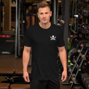 Jolly Roger Pirate Emblem – Skull and Crossed Swords Design – Historic Pirate Flag Inspired Unisex t-shirt image 3