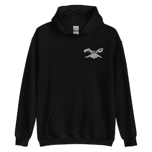May include: Black hooded sweatshirt with a silver embroidered design of crossed swords and a crown on the chest.