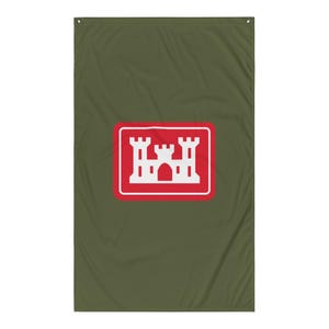May include: Olive green flag featuring a red rectangle with a white castle emblem. The castle has three towers. The flag has a grommet in each top corner.