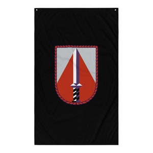 May include: A black flag with a red, white, and purple shield with a sword in the center. The shield is surrounded by a rope border.