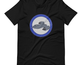 May include: Black t-shirt with a blue circle graphic featuring a cartoon illustration of a gray jet plane with a white outline. The plane is flying in a circle with a white cloud behind it.