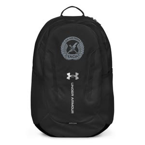 Pode incluir: Mochila preta Under Armour com um logotipo TACP da Força Aérea dos EUA em cinza e o logotipo da Under Armour em cinza.