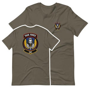 May include: Olive green t-shirts with a graphic of a skull wearing a hood, wings, and a sword, with the text "TASK FORCE 141". The design is on the front and back of the shirt.