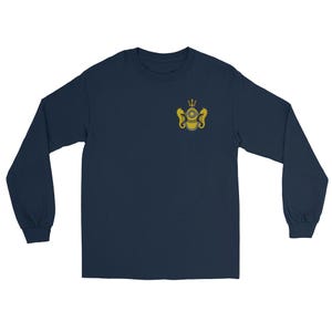 May include: A navy blue long-sleeve t-shirt featuring a small, centered graphic on the upper left chest. The graphic depicts a gold-colored vintage deep-sea diving helmet flanked by two seahorses, topped with a trident symbol in a circular frame.