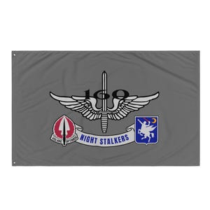 May include: A gray flag with the 160th Special Operations Aviation Regiment insignia, also known as the Night Stalkers. The insignia features a winged trident, the number 160, and the words "Night Stalkers". The flag also includes the unit's motto, "Volare Optimos", and the 101st Airborne Division patch.