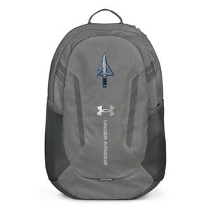 May include: Gray Under Armour backpack with a blue and white logo and the Under Armour logo. The backpack has a top handle, side mesh pockets, and gray accents. The text "UNDER ARMOUR" is printed vertically on the front.